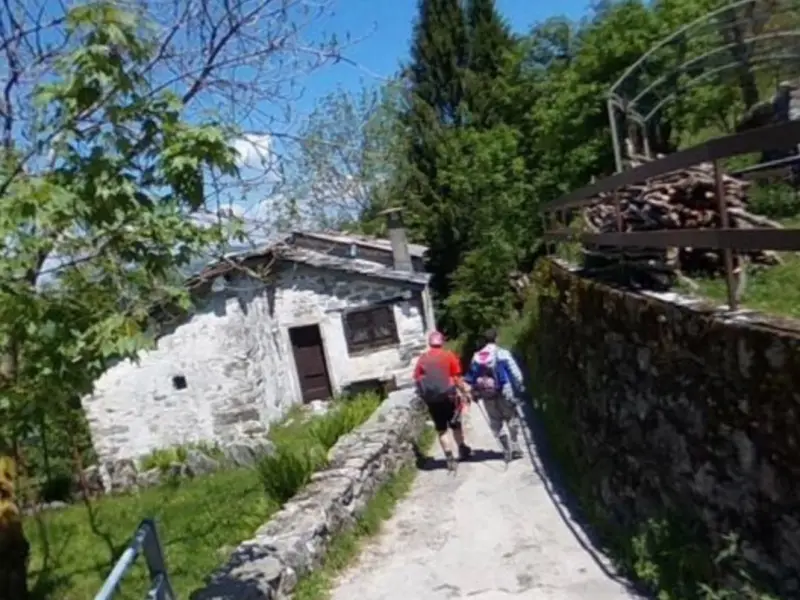 Street view on the Val d'Intelvi Mountain Hike, with hikers on a stone lane